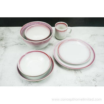 Reactive glazed stoneware dinner set with pink rim